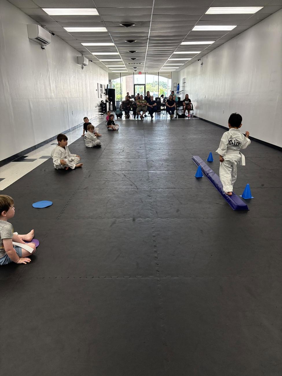 The training floor and parent viewing area at Legacy Martial Arts